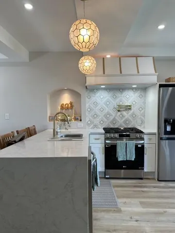 a view of a chairs and table in patio