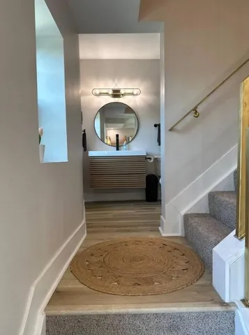 a bathroom with a shower and a sink