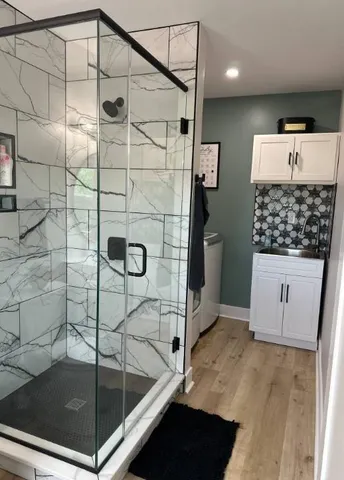 a bedroom with a bed and a mirror