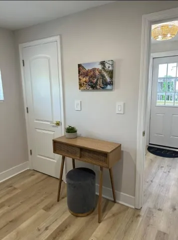 a bedroom with a bed chair and a window