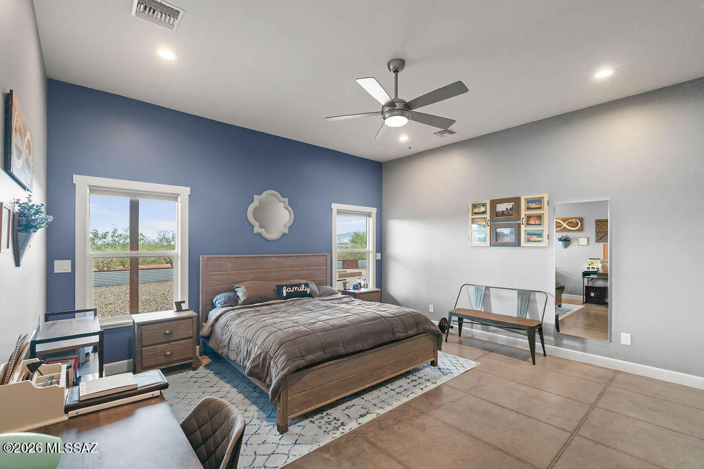 16276 East Empire View Road Vail, AZ 85641 - Photo 35 of 51 a bedroom with a bed and a chandelier