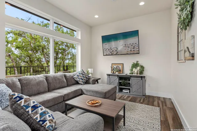 a living room with furniture and a large window