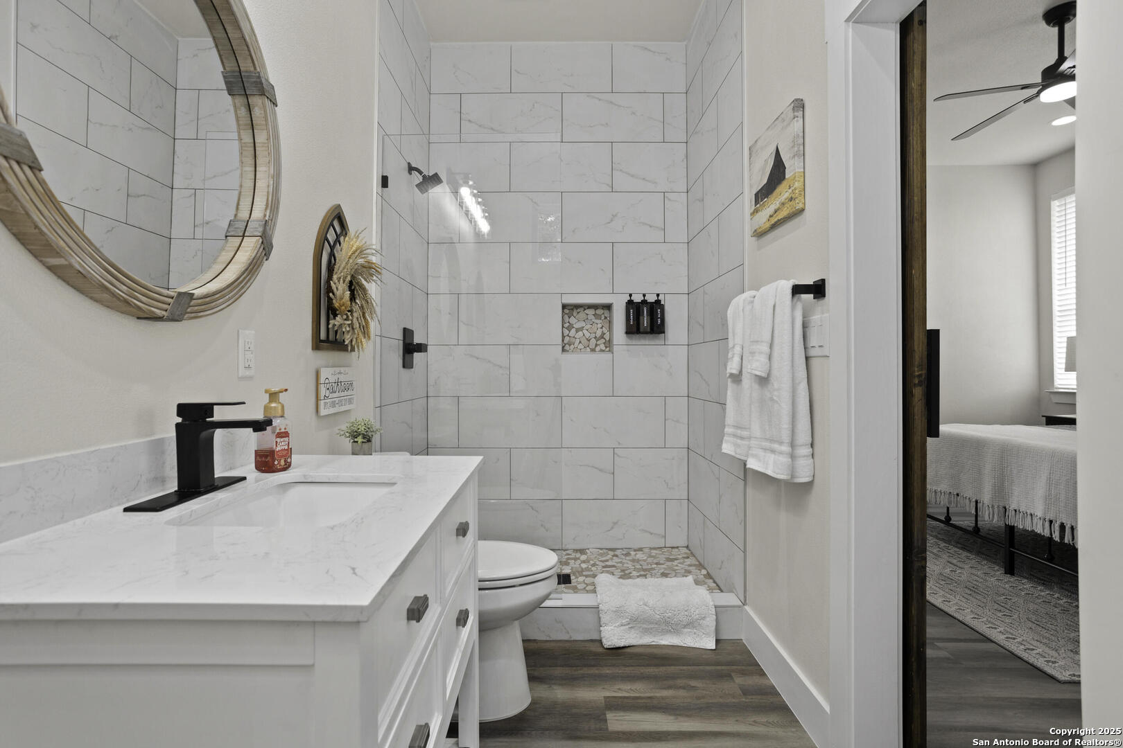 1121 Gruene Road, Unit A New Braunfels, TX 78130 - Photo 20 of 28 a bathroom with a sink and a mirror