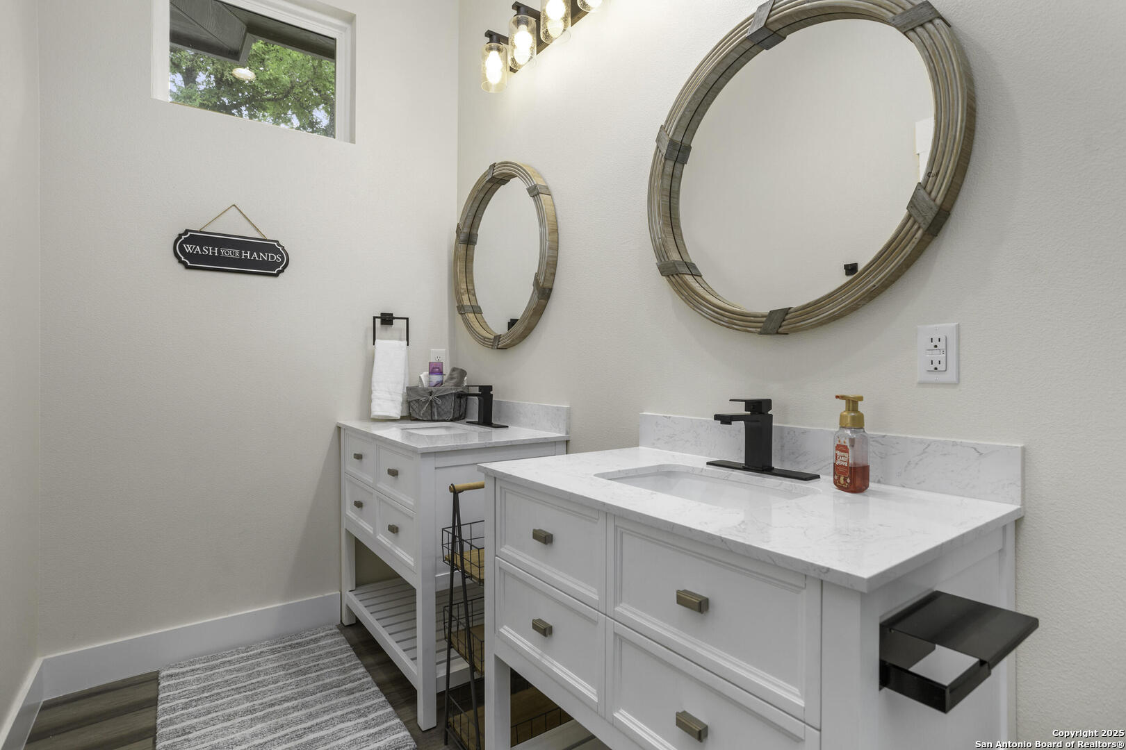 1121 Gruene Road, Unit A New Braunfels, TX 78130 - Photo 25 of 28 a bathroom with a sink and a mirror