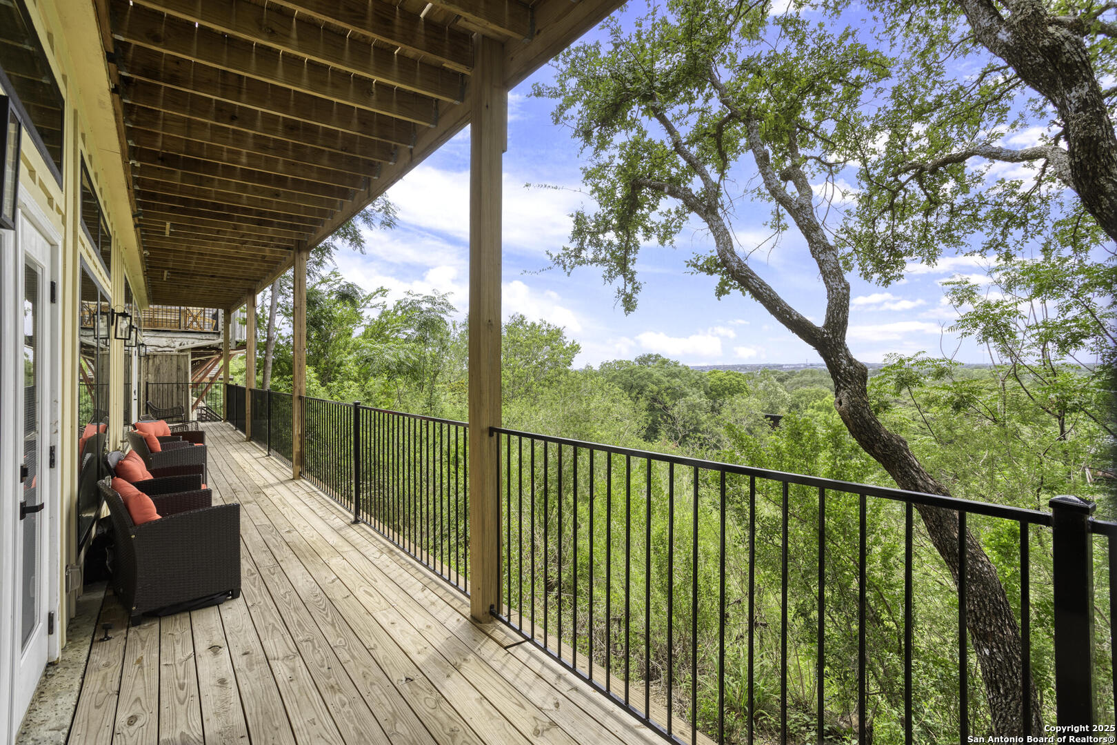 1121 Gruene Road, Unit A New Braunfels, TX 78130 - Photo 27 of 28 a balcony with wooden floor and outdoor seating