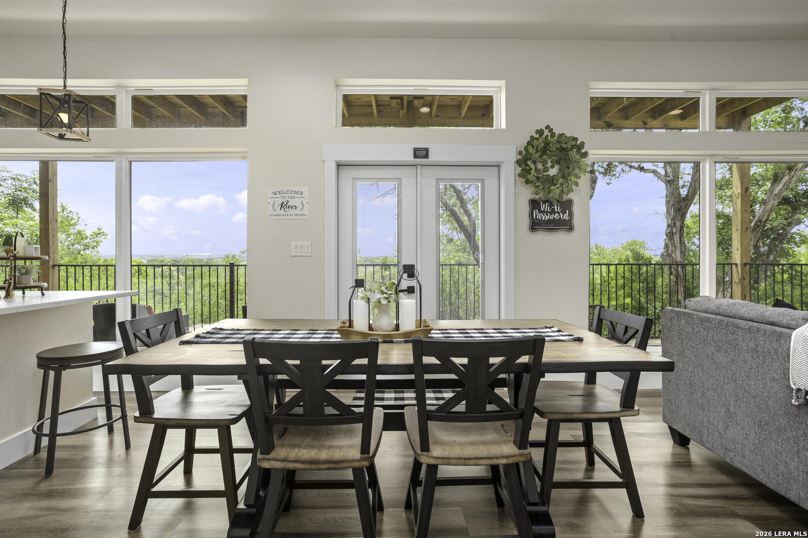 1121 Gruene Road, Unit A New Braunfels, TX 78130 - Photo 5 of 28 a view of a dining room with furniture large windows and wooden floor