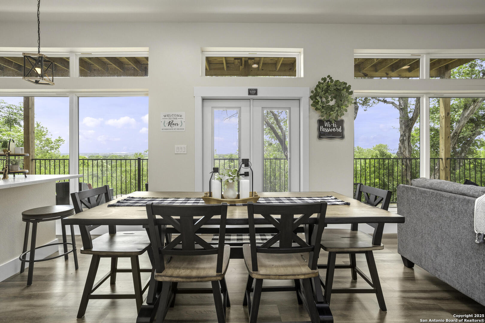 1121 Gruene Road, Unit A New Braunfels, TX 78130 - Photo 6 of 28 a view of a dining room with furniture large windows and wooden floor