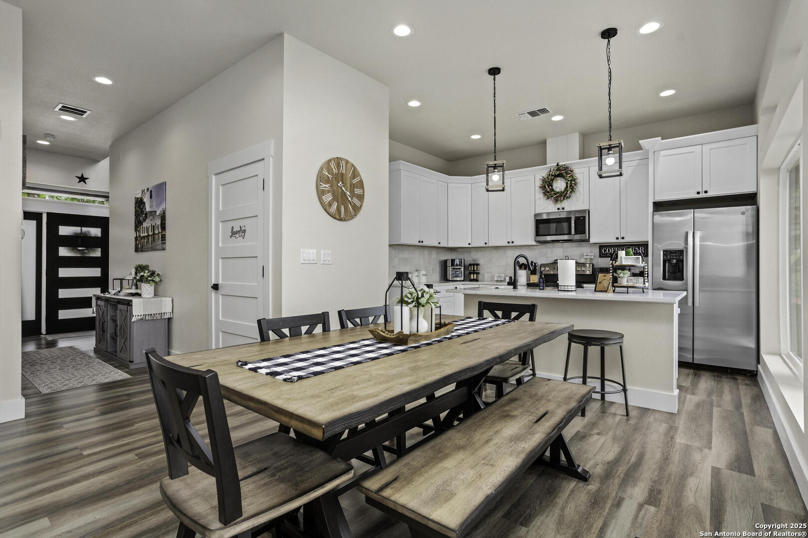 1121 Gruene Road, Unit A New Braunfels, TX 78130 - Photo 7 of 28 a kitchen with kitchen island stainless steel appliances a stove a table and chairs in it