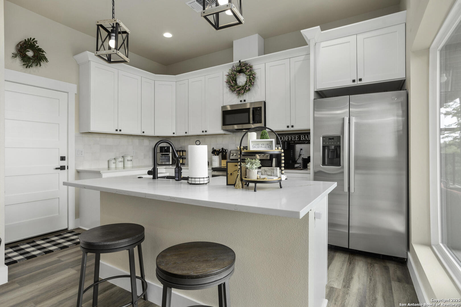 1121 Gruene Road, Unit A New Braunfels, TX 78130 - Photo 8 of 28 a kitchen with stainless steel appliances a refrigerator sink and cabinets