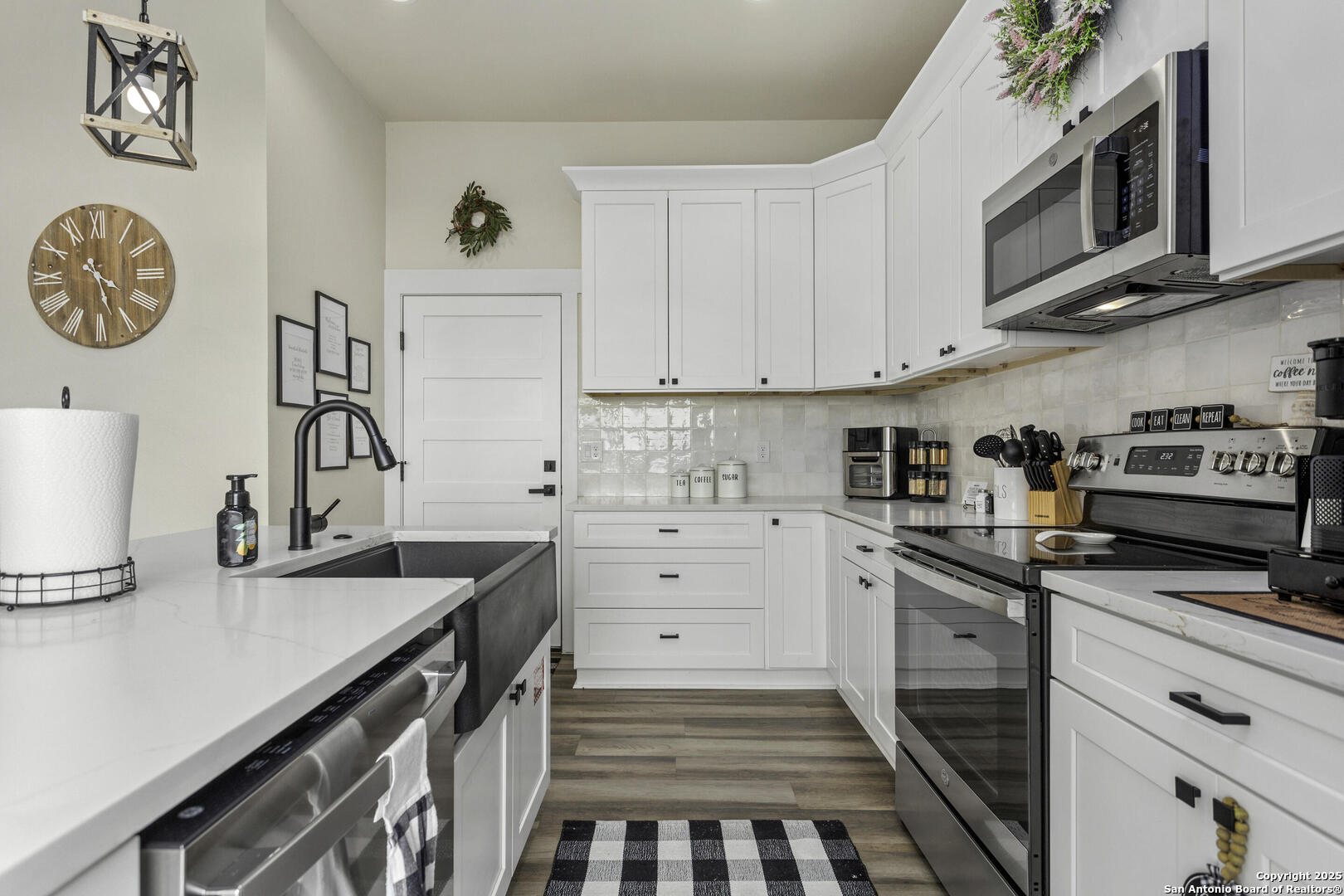1121 Gruene Road, Unit A New Braunfels, TX 78130 - Photo 10 of 28 a kitchen with granite countertop a sink a stove and cabinets