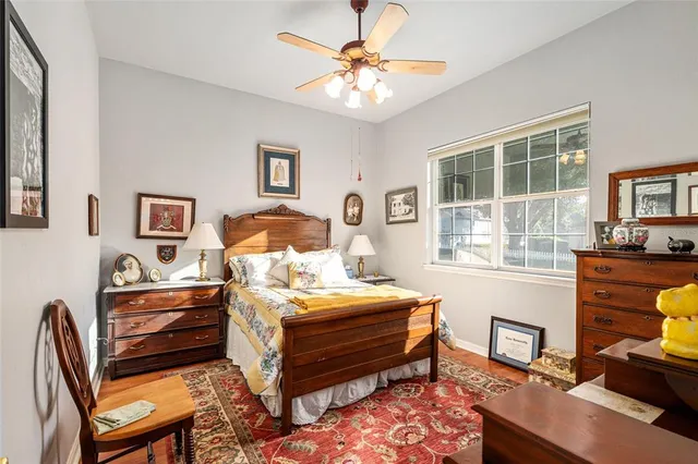 a bedroom with bed and a window