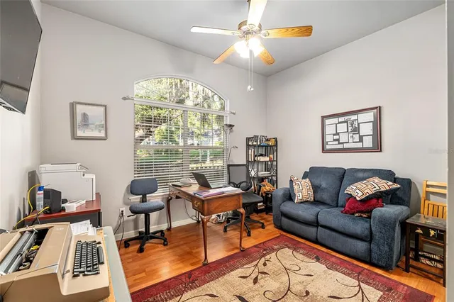 a living room with furniture and a large window