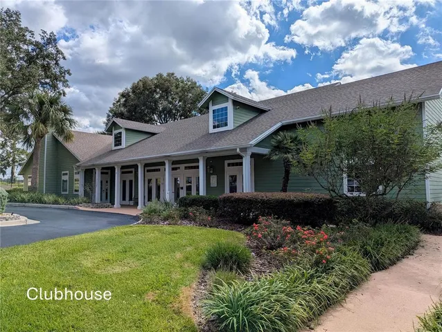 a front view of a house with garden and porch