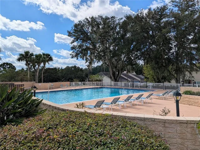 a view of a swimming pool with a patio