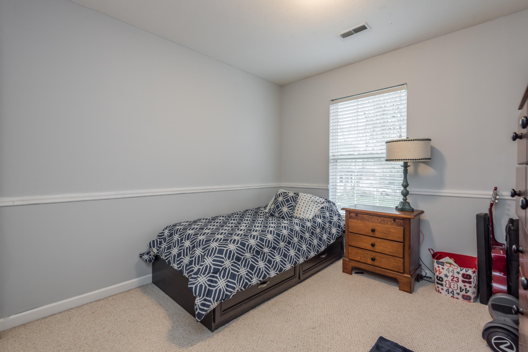 829 Station View Road Knoxville, TN 37919 - Photo 22 of 26 a bedroom with a bed and a dresser