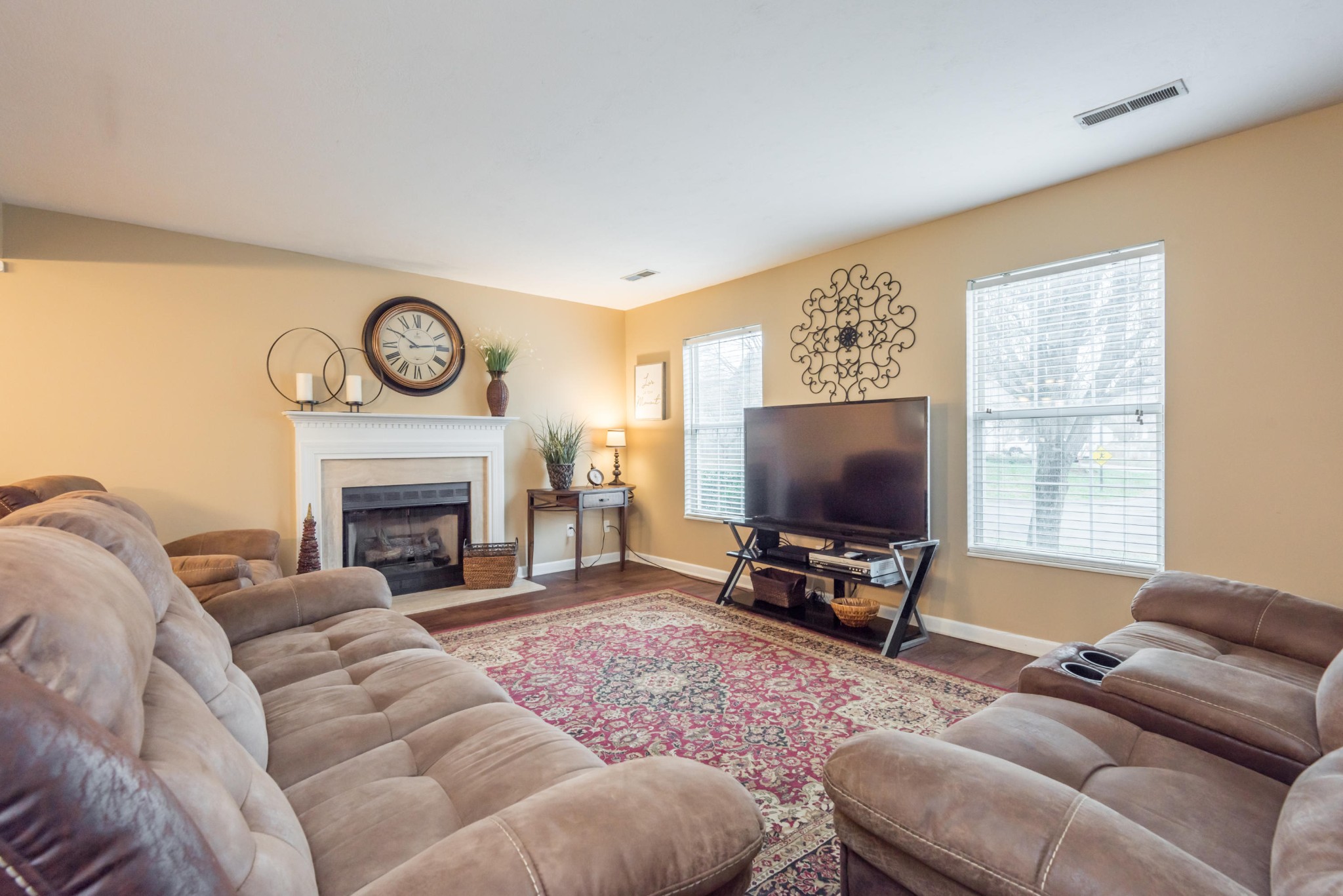 829 Station View Road Knoxville, TN 37919 - Photo 8 of 26 a living room with furniture a fireplace and a flat screen tv