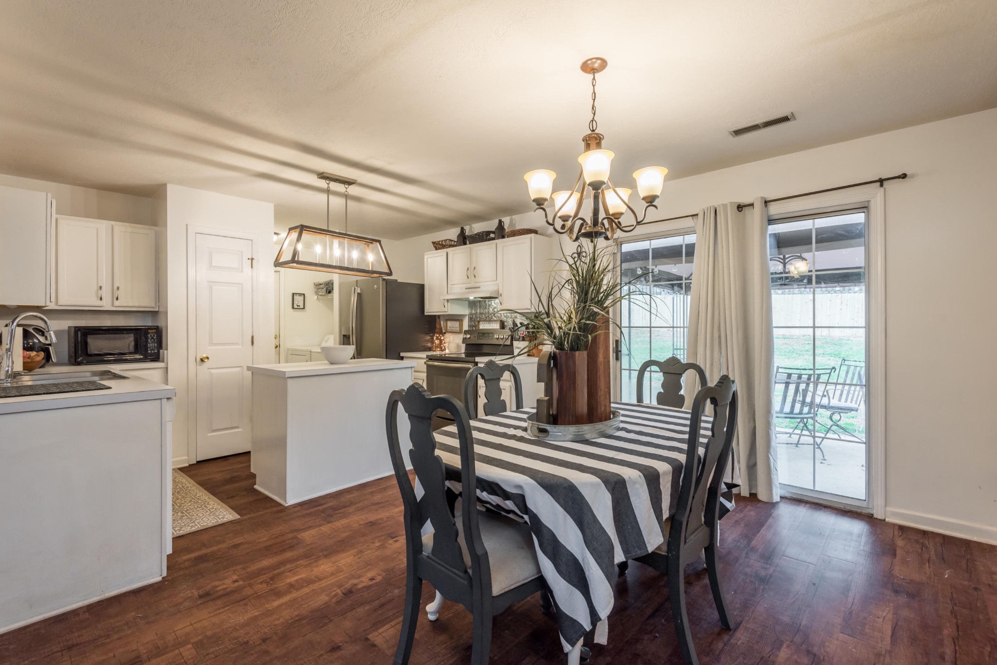 829 Station View Road Knoxville, TN 37919 - Photo 10 of 26 a view of a dining room with furniture and wooden floor