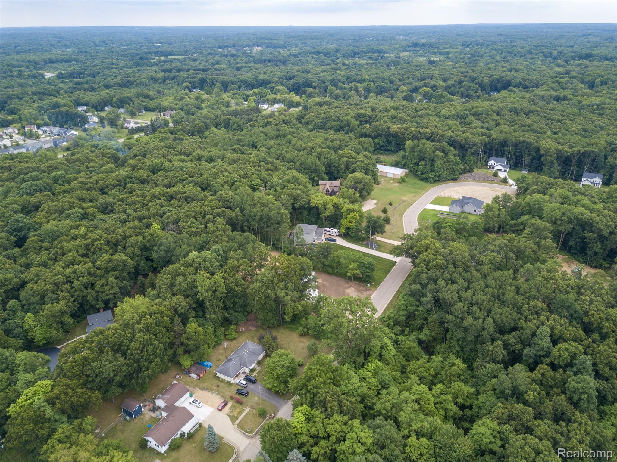 16085 Catalpa Ridge Holly, MI 48442 - Photo 33 of 40 Expansive wooded landscape featuring mature trees and scattered residential properties