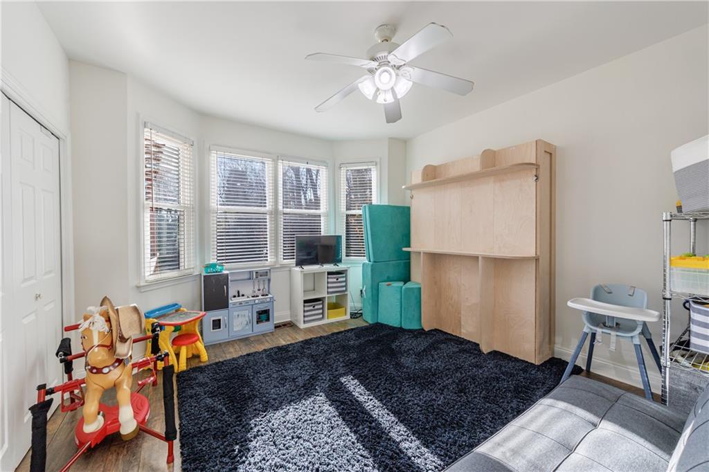 6010 Masters Club Drive Suwanee, GA 30024 - Photo 18 of 65 a living room with furniture rug and a window
