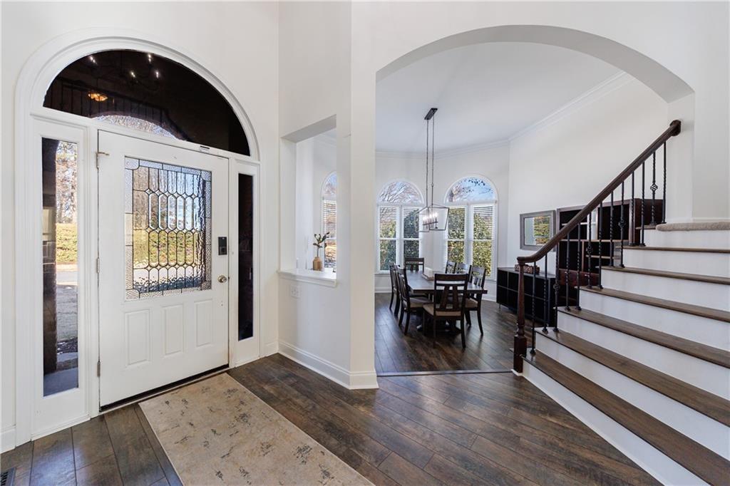 6010 Masters Club Drive Suwanee, GA 30024 - Photo 4 of 65 a view of entryway and hall with wooden floor