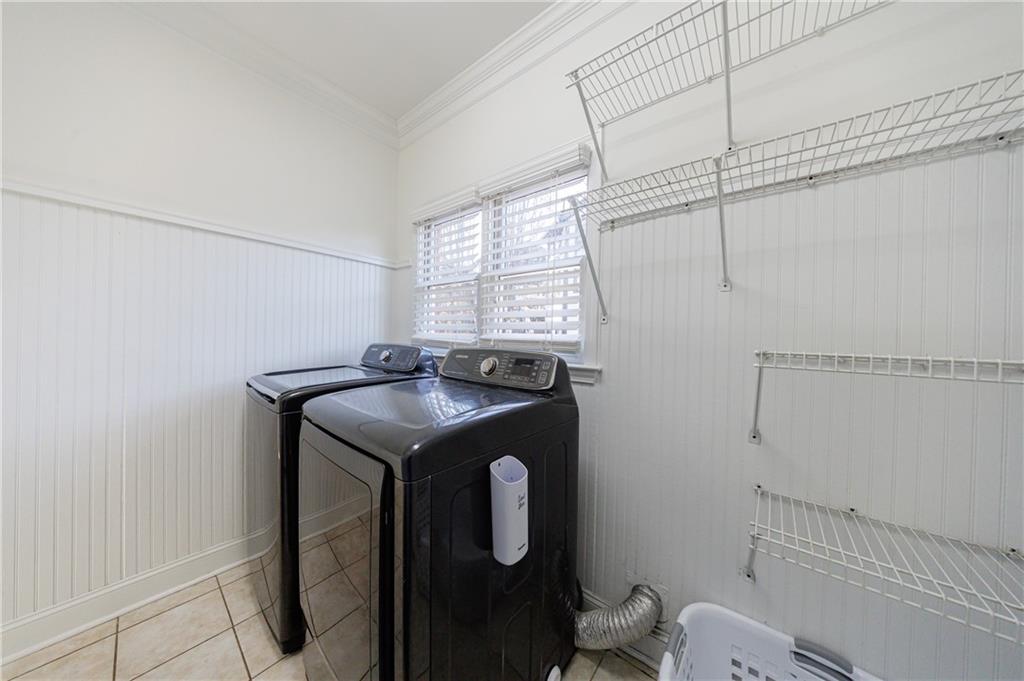 6010 Masters Club Drive Suwanee, GA 30024 - Photo 47 of 65 a utility room with dryer and washer