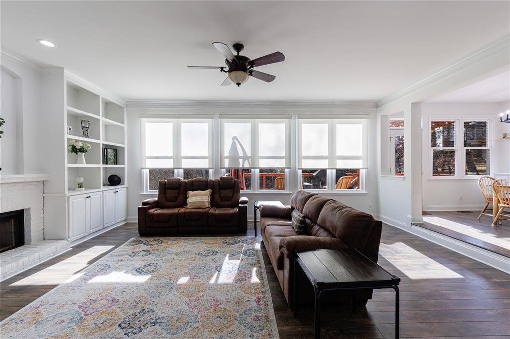 6010 Masters Club Drive Suwanee, GA 30024 - Photo 8 of 65 a living room with furniture and a large window