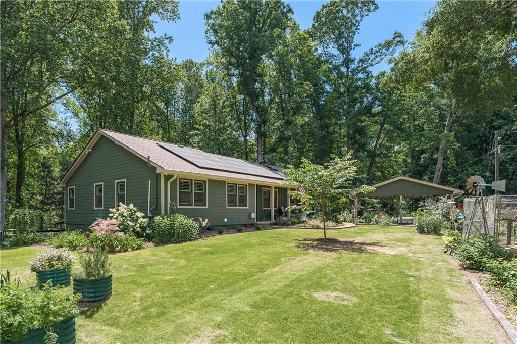 16035 New Bull Pen Road Alpharetta, GA 30004 - Photo 1 of 1 a front view of house with yard and green space