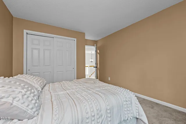 a bedroom with a bed and a closet