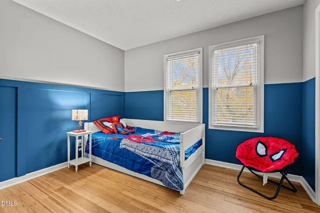 a bedroom with bed and a window