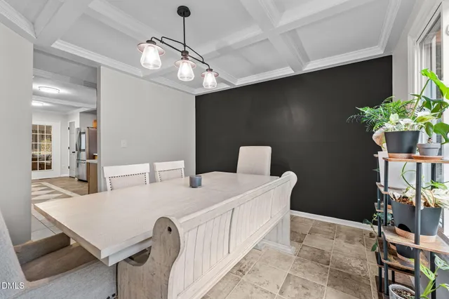 a very nice looking dining room with a table and chairs