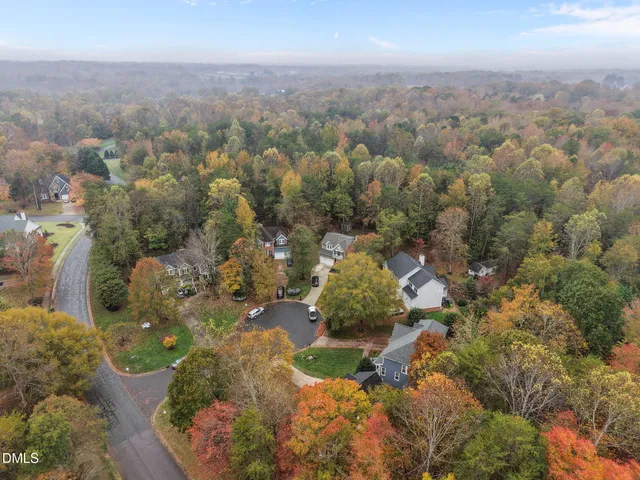 an aerial view of a house with pool