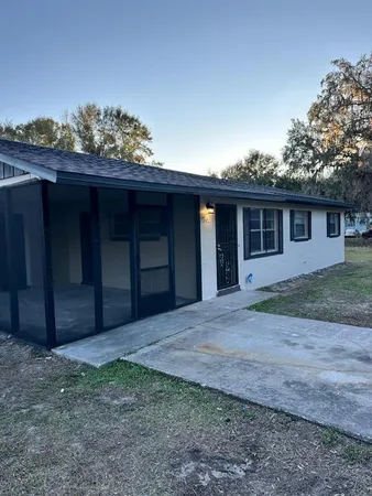 a house view with a backyard space