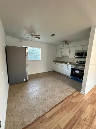 a view of a kitchen with a sink