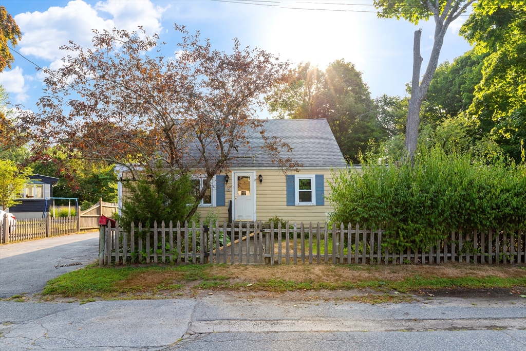 4 Arrowhead Trail Ipswich, MA 01938 - Photo 1 of 39 a front view of house with yard and trees