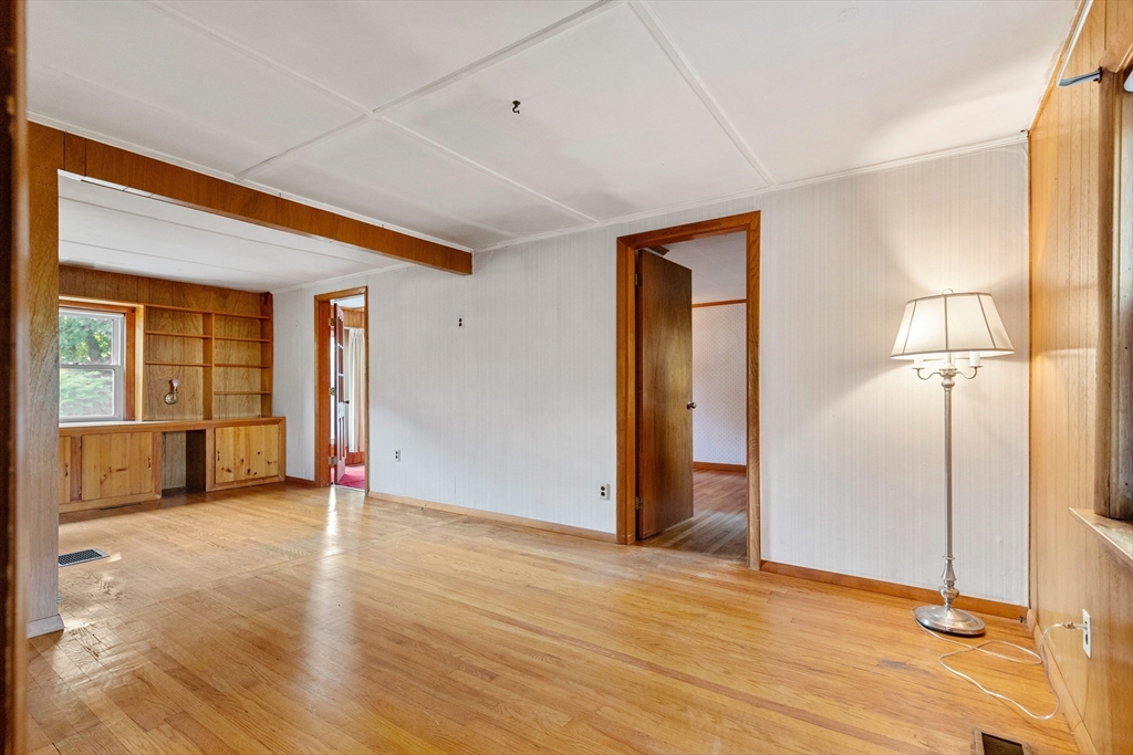 4 Arrowhead Trail Ipswich, MA 01938 - Photo 25 of 39 a view of an empty room with wooden floor and a window