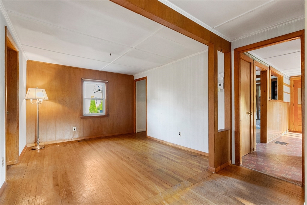 4 Arrowhead Trail Ipswich, MA 01938 - Photo 27 of 39 an empty room with wooden floor and windows