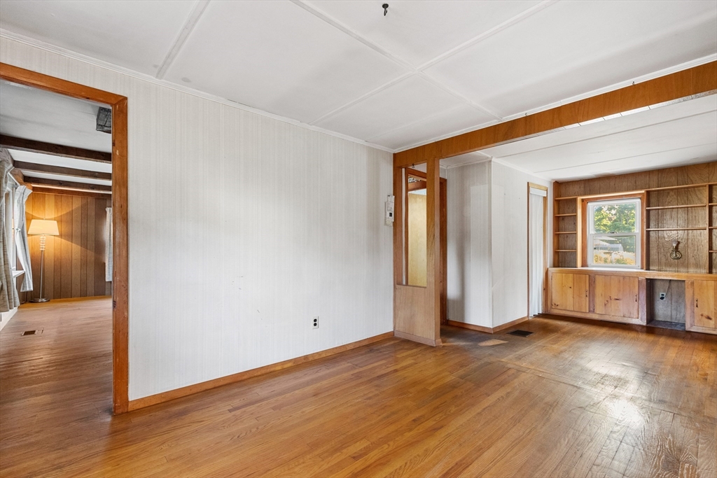 4 Arrowhead Trail Ipswich, MA 01938 - Photo 28 of 39 an empty room with wooden floor and windows