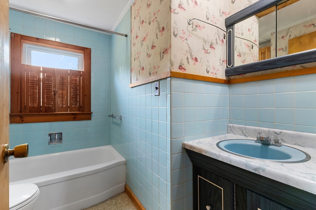 4 Arrowhead Trail Ipswich, MA 01938 - Photo 34 of 39 a bathroom with a sink a toilet and shower