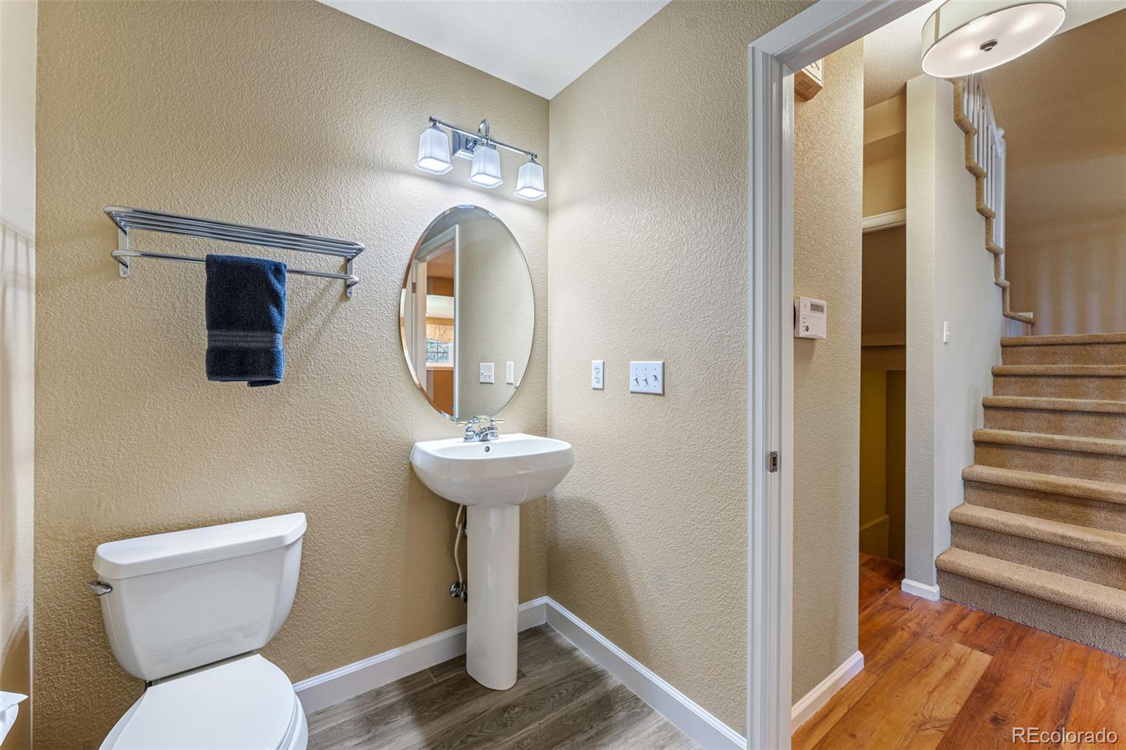 41 Quince Street Denver, CO 80230 - Photo 16 of 47 a view of bathroom with a toilet and a mirror