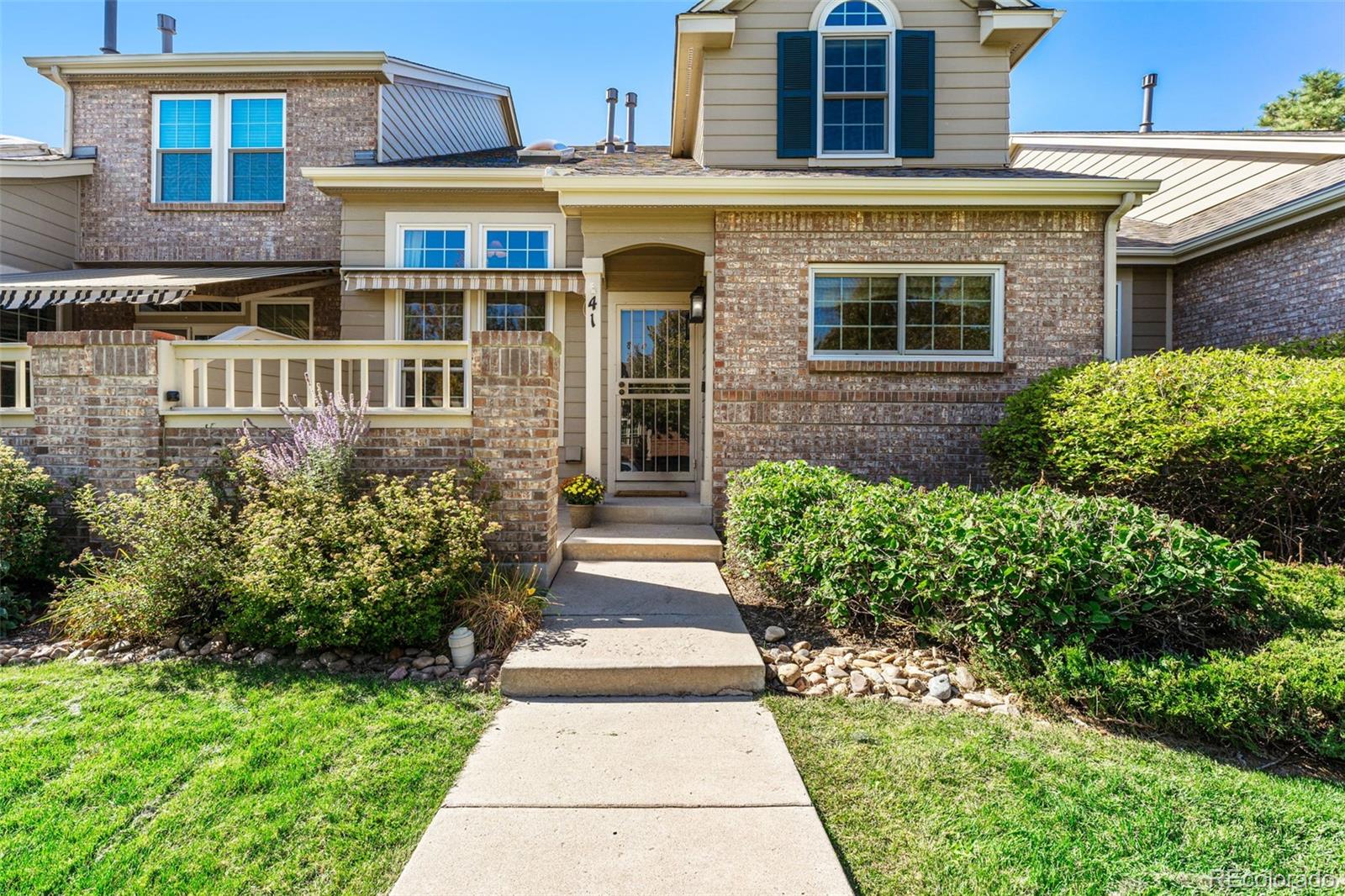41 Quince Street Denver, CO 80230 - Photo 2 of 47 a front view of a house with garden