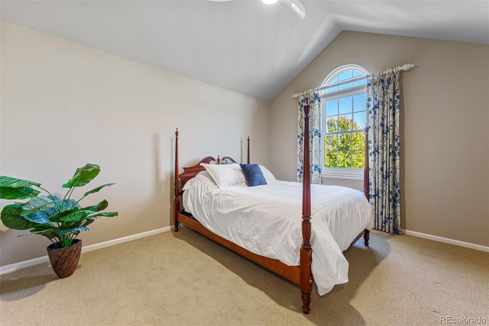 41 Quince Street Denver, CO 80230 - Photo 28 of 47 a bed sitting in a bedroom next to a window