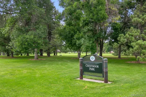 a view of a backyard with large trees