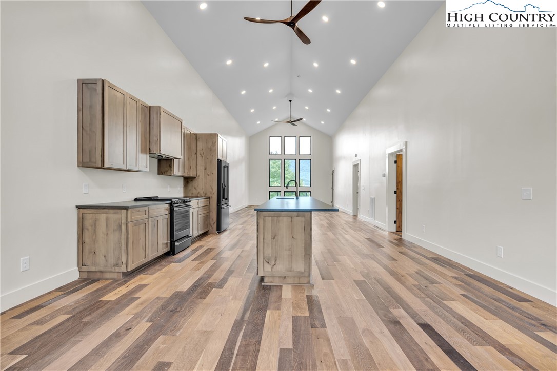 Range View Drive, Unit TBD Jefferson, NC 28640 - Photo 11 of 46 a view of a kitchen with kitchen island wooden floor center island and stainless steel appliances