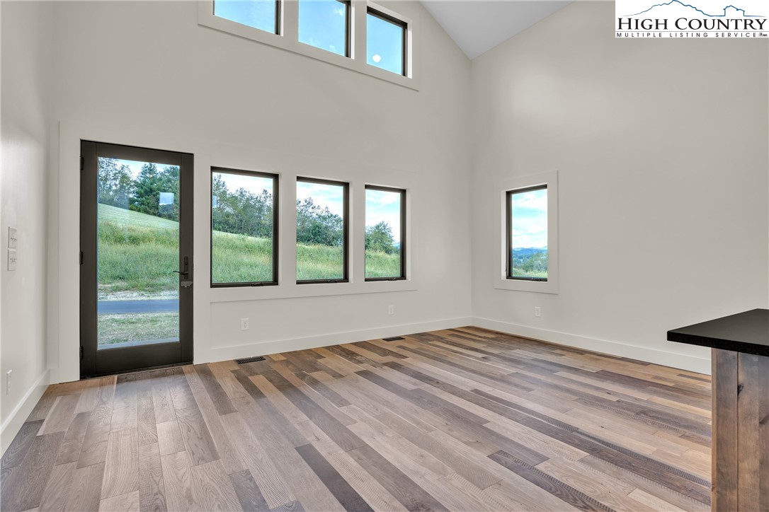 Range View Drive, Unit TBD Jefferson, NC 28640 - Photo 12 of 46 a view of an empty room with wooden floor and a window