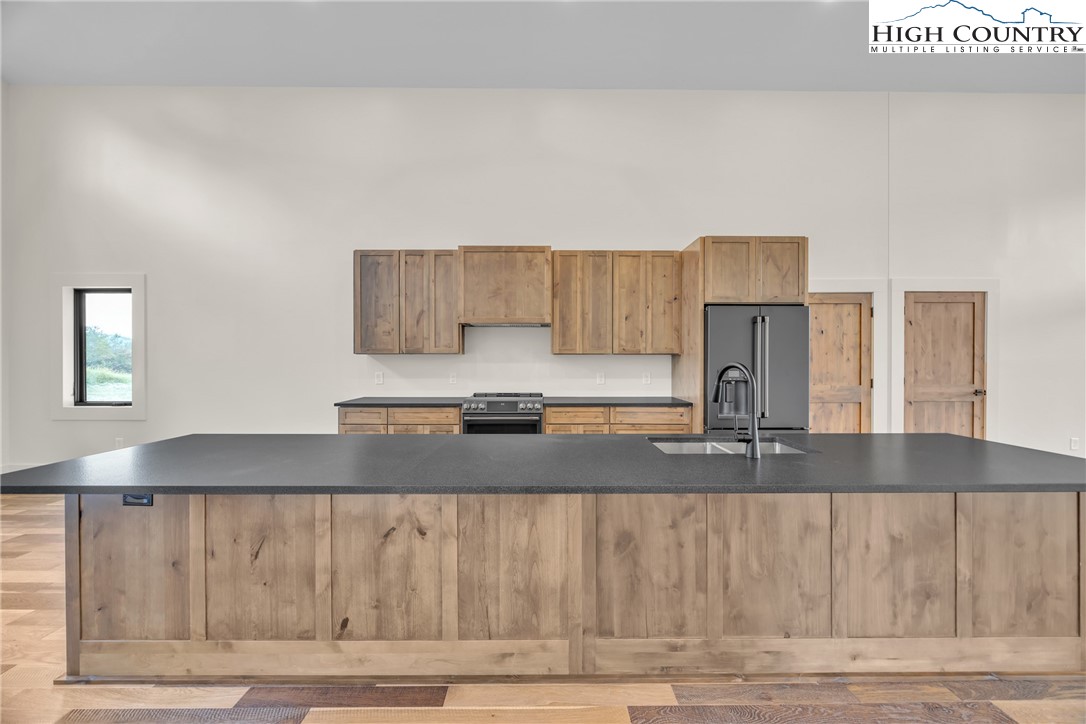 Range View Drive, Unit TBD Jefferson, NC 28640 - Photo 13 of 46 a kitchen with kitchen island granite countertop a sink and a granite counter tops