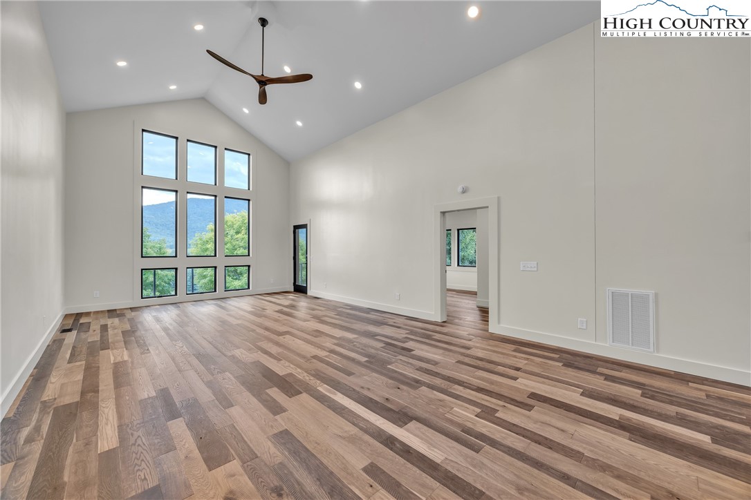 Range View Drive, Unit TBD Jefferson, NC 28640 - Photo 17 of 46 a view of an empty room with a window and wooden floor