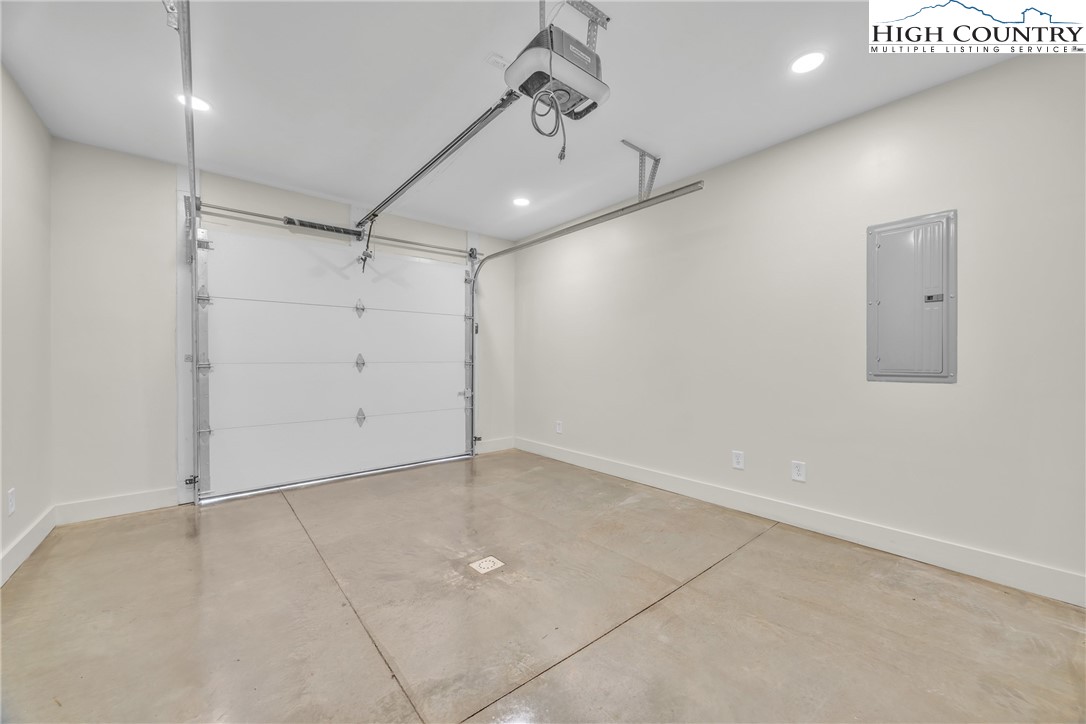 Range View Drive, Unit TBD Jefferson, NC 28640 - Photo 38 of 46 an empty room with a ceiling fan and windows