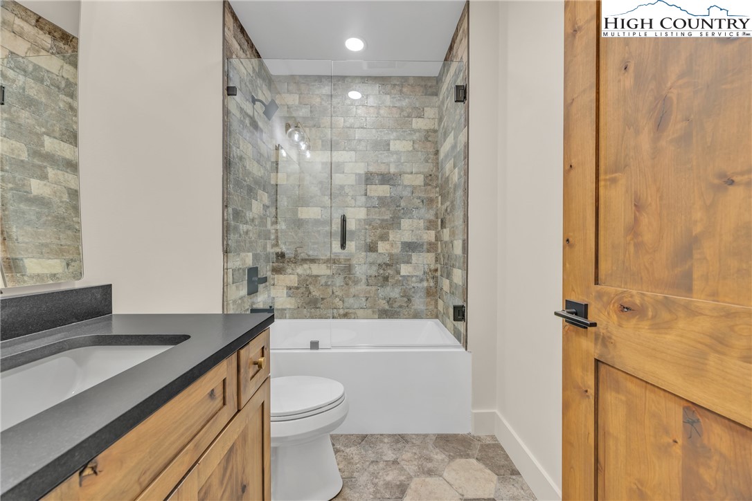 Range View Drive, Unit TBD Jefferson, NC 28640 - Photo 39 of 46 a bathroom with a granite countertop bathtub shower sink vanity and toilet