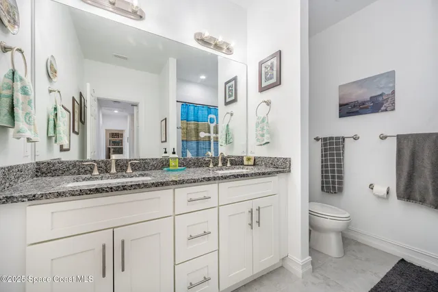 a bathroom with a sink a washer and dryer