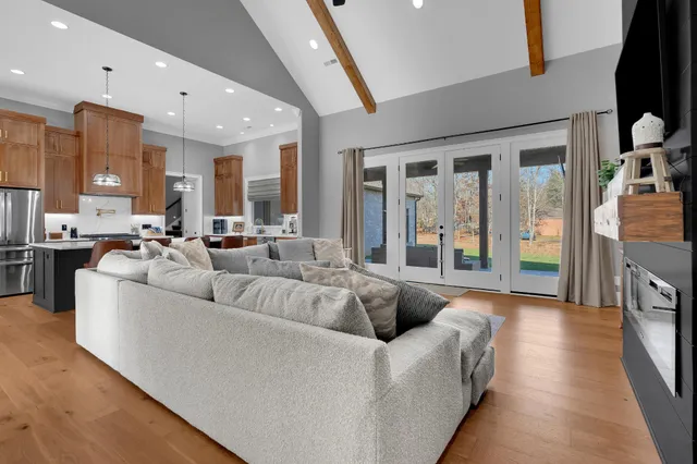 a kitchen with stainless steel appliances a sink stove and cabinets